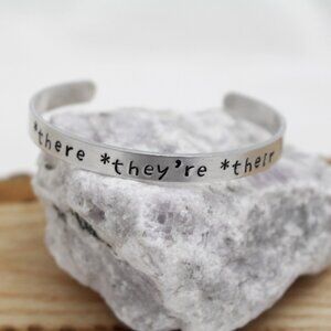 *There *They're *Their - Hand Stamped Anodized Aluminum Bangle - Adjustable